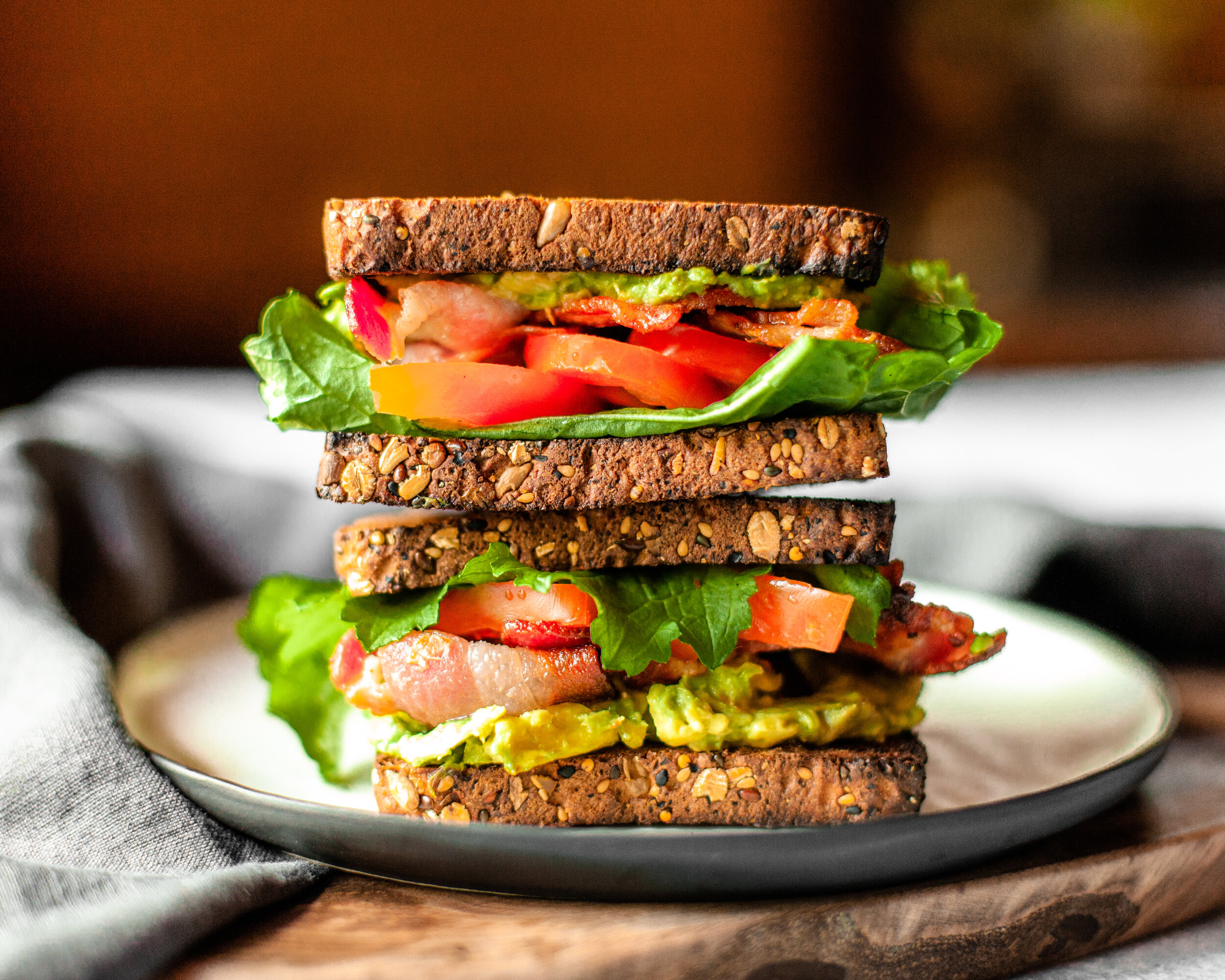 A BLAT sandwich is made with multigrain bread.